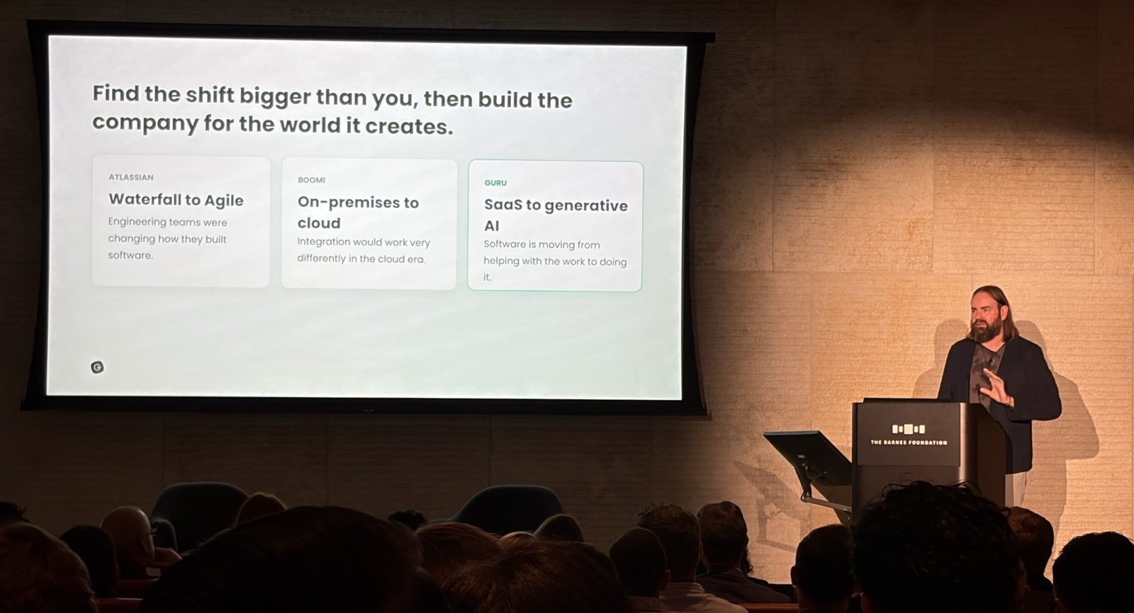 Slide: Find the shift bigger than you, then build the company for the world it creates. Atlassian: waterfall to agile. Boomi: on-premises to cloud. Guru: SaaS to generative AI